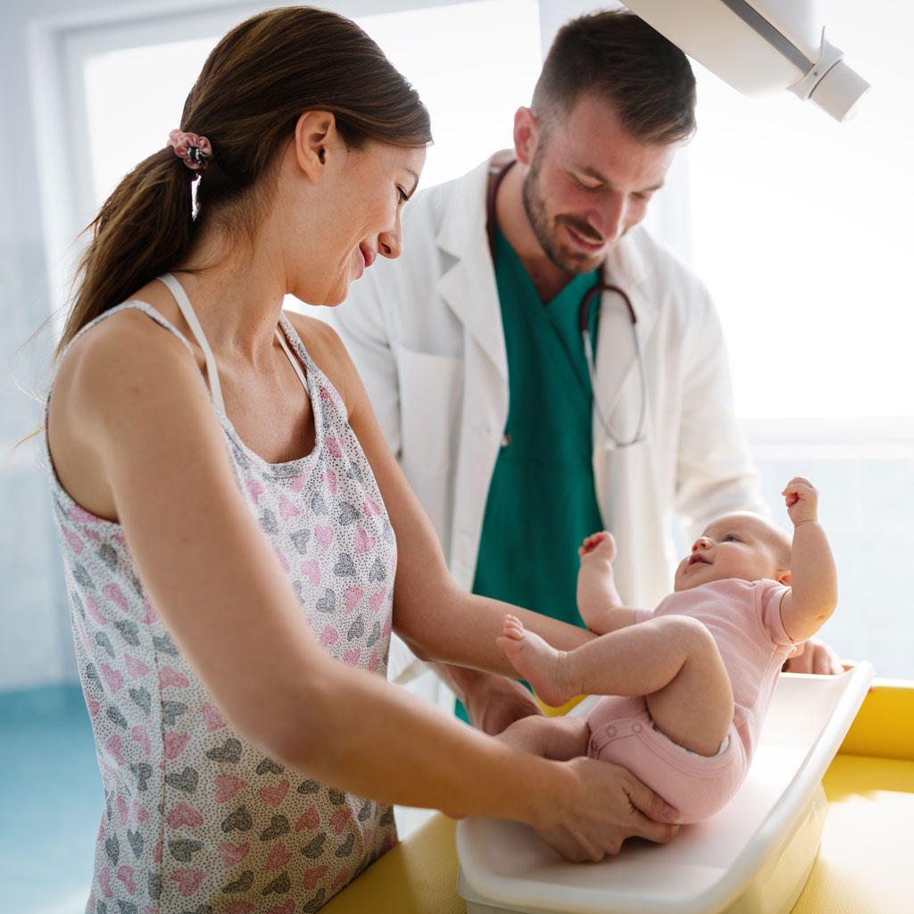 beautiful-mother-and-baby-on-medical-examination-w-GQYH5K4.jpg